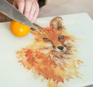 glass fox worktop saver with orange and knife